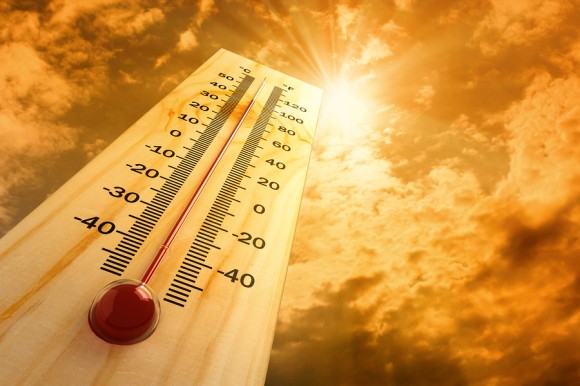 Thermometer under the sun in a hot day, showing high temperatures